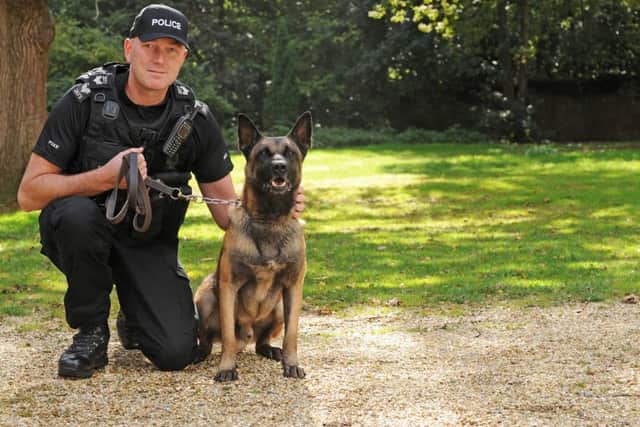 Sgt Brendan Close with his Belgium Shepherd Merlin who is four years old.
Picture: Sarah Standing