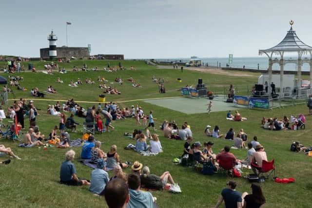 People enjoying the music and sun at the Southsea Bandstand on Saturday.Picture: Keith Woodland 180298-25