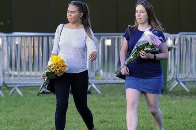 Floral tributes are about to be laid to Tommy Cowan and Georgia Jones