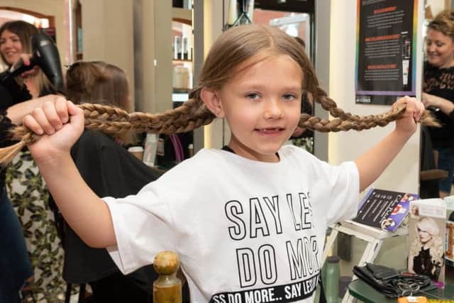 India Roy with hair braided in to four lengths prior to them being cut off.
Picture: Keith Woodland