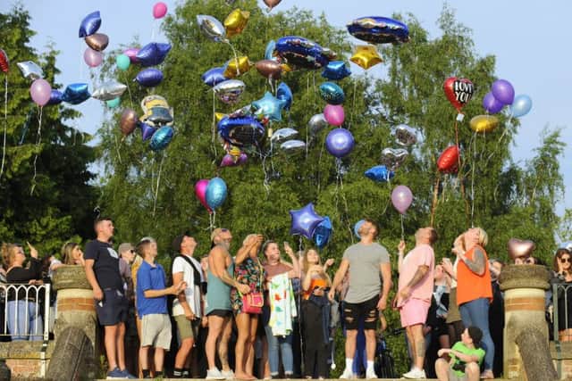 Family and friends gathered on Monday evening at Staunton Country Park at Havant to release balloons in respect of Tommy Cowan who died after being at The Mutiny Festival that was held on King George V Playing Fields at Cosham, Portsmouth. Family of Georgia Jones, 18, who died after falling ill at the festival, attended the memorial event held on Monday evening.Picture: Malcolm Wells (180528-6219)