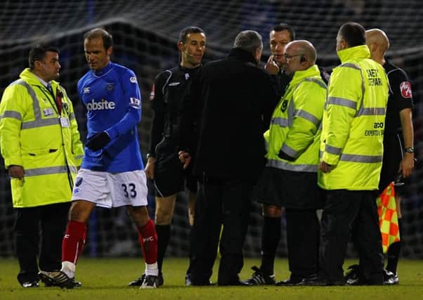 Pompey boss Avram Grant confronts referee Kevin Friend on the Fratton Park pitch at half-time in 2010