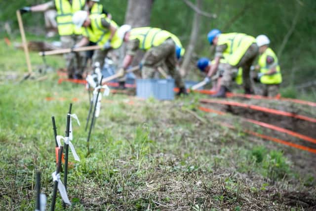 Police excavate an area of land in Paderborn in Germany