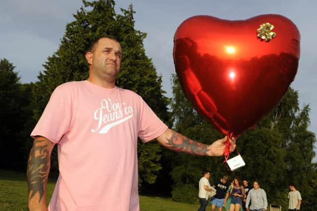 Tommy Cowan's father Damian at a balloon release in memory of his son