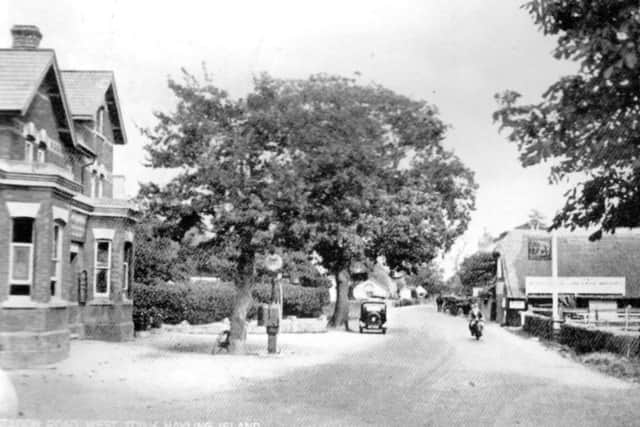 Perhaps a 1930s' view, this is Station Road, West Town, Hayling Island. Is that a petrol pump on the side of the road do you think? 
Picture: Roger Allen Collection