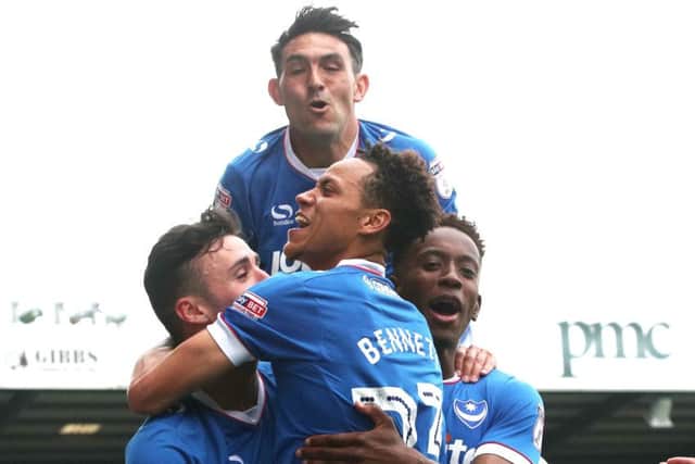 Kyle Bennett celebrates scoring against Cheltenham with Enda Stevens, Gary Roberts and Jamal Lowe - the only one of the four still at Pompey
