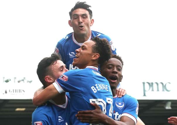 Kyle Bennett celebrates scoring against Cheltenham with Enda Stevens, Gary Roberts and Jamal Lowe - the only one of the four still at Pompey