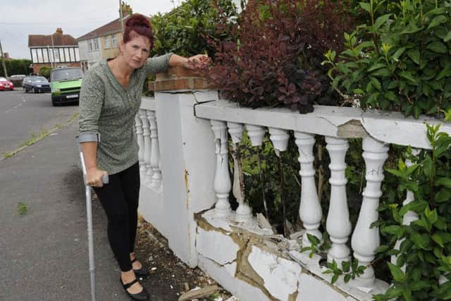 Crina Parker who is upset after a car crashed into her wall at her home in Gosport.
Picture Ian Hargreaves (180491-1)