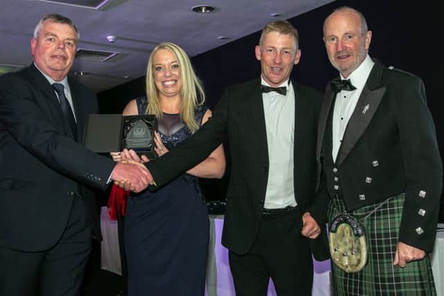 Chantelle and Peter Williams (centre) with Fishing News editor David Linkie (left) and comedian Fred MacAulay
