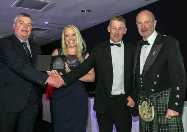 Chantelle and Peter Williams (centre) with Fishing News editor David Linkie (left) and comedian Fred MacAulay