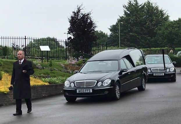 A hearse carrying Tommy McGhee arrives at Portchester Crematorium