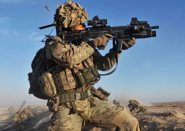 A soldier with the 4th Mechanised Brigade is pictured engaging the enemy during Operation Qalb in Helmand, Afghanistan. PPP-160202-120854001