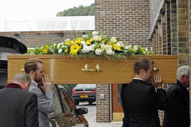 Tommy McGhee's loved ones carry him into Portchester Crematorium. Picture: Ian Hargreaves