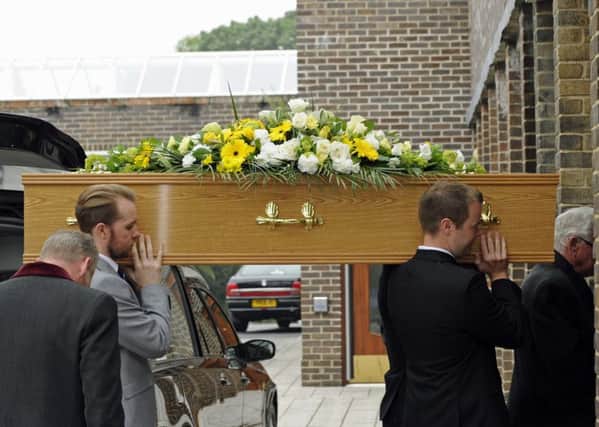 Tommy McGhee's loved ones carry him into Portchester Crematorium. Picture: Ian Hargreaves