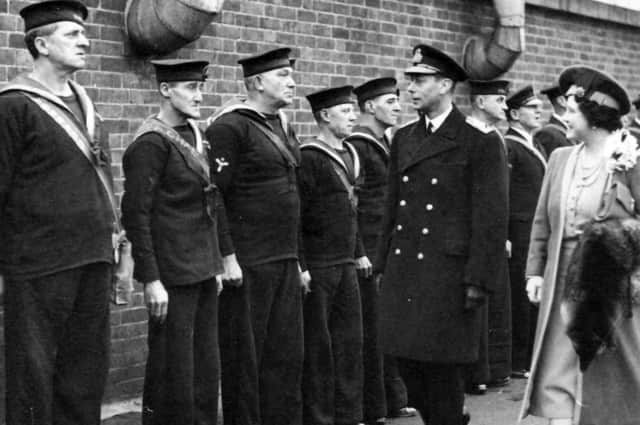 King George VI and Queen Elizabeth inspect sailors who have returned to the colours from civvy street, December 4, 1941.