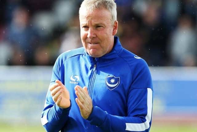 Pompey boss Kenny Jackett is celebrating a year in charge at Fratton Park