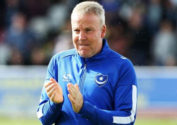 Pompey boss Kenny Jackett is celebrating a year in charge at Fratton Park