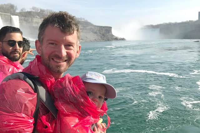 Steve Canavan using his daughter Mary as a human shielf at Niagara Falls