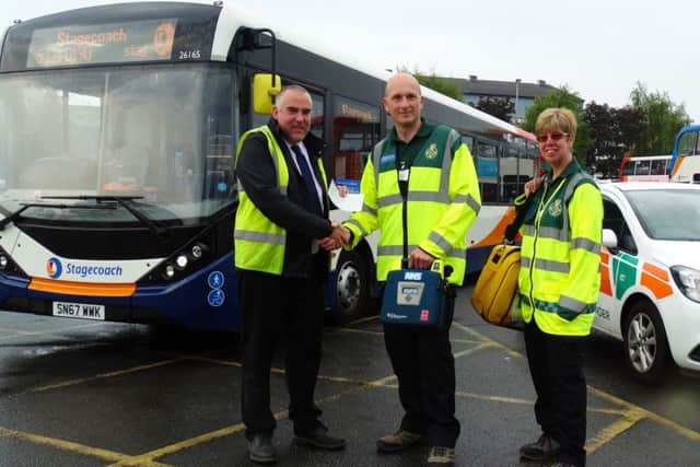 Stagecoach has given £250 to the North Harbour Community First Responders. Left to right Stagecoach operations manager Colin Ashcroft and community first responder volunteers Bernie Cook and Carol Carter