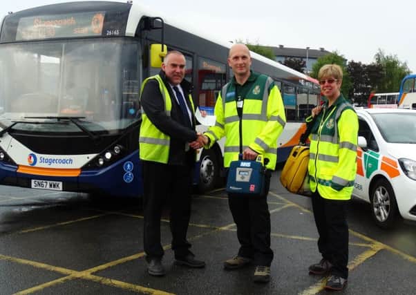 Stagecoach has given Â£250 to the North Harbour Community First Responders. Left to right Stagecoach operations manager Colin Ashcroft and community first responder volunteers Bernie Cook and Carol Carter