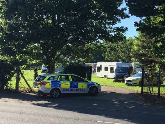 The travellers and police at Watersedge Park in Portsmouth. Picture: Tony Hewitt