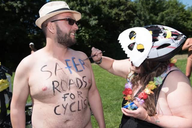 Leo Smith is body painted by Fiona Jones before the ride. Picture: Vernon Nash (180390-138) PPP-180206-181734006