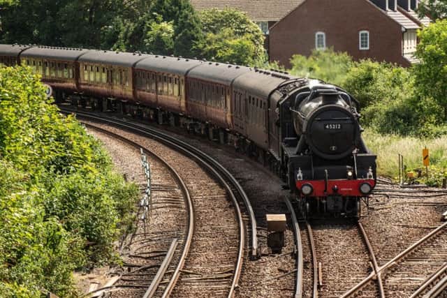 Steam Train in Portsmouth - The black locomotive and train approach Havant Station (unfortunately there was not much steam)
Picture: Vernon Nash (180388-0026) PPP-180206-181932006