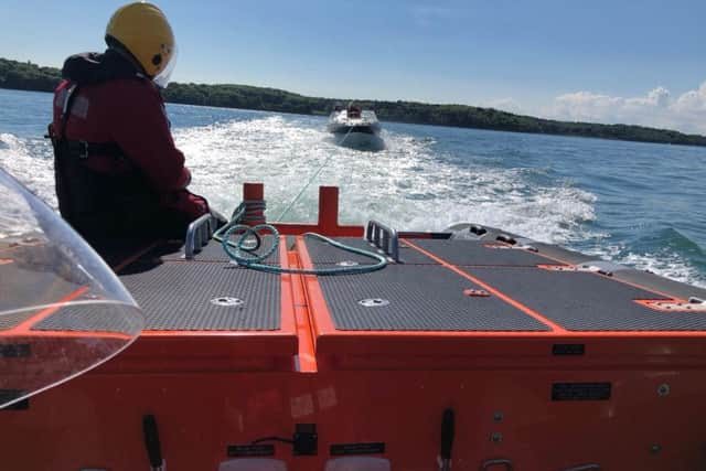 GAFIRS crew tow a vessel to its mooring