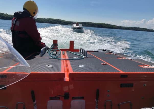 GAFIRS crew tow a vessel to its mooring