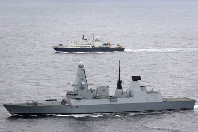 HMS Diamond (foreground) escorting the Russian military ship Yantar through the English Channel earlier this month. PHOTO: MoD