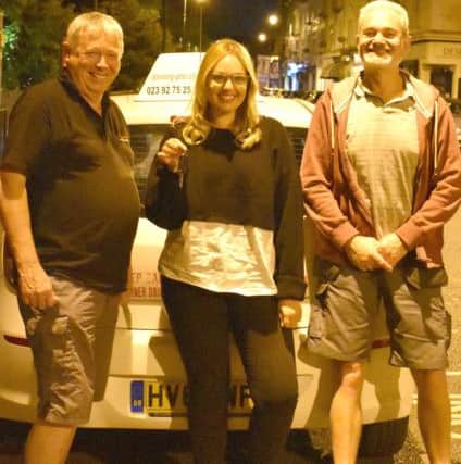 Sophie Cotton with her dad Dave and driving instructor Liam Greaney
