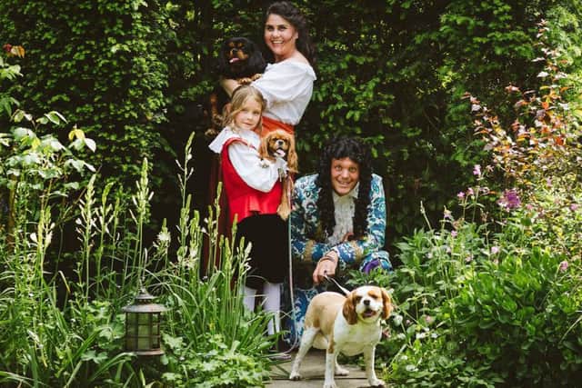 Cast members and the trio of dogs chosen. Credit: West Meon Theatre