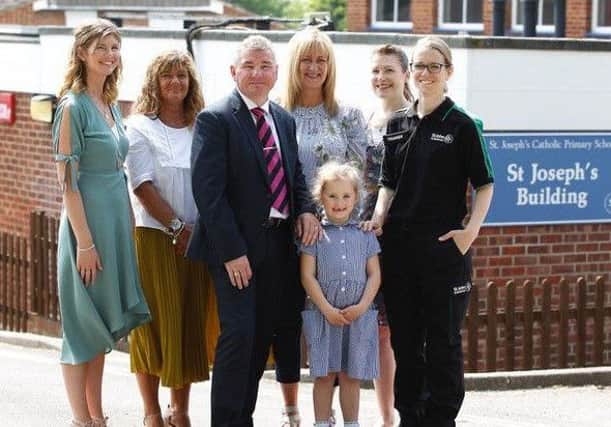 Teaching staff from St Joseph's Primary. From left, Lorraine Williams, Debbie Flynn, Bill James, Kelly Ralls and Bryony Lawrence, and St John Ambulance first aid trainer, Jo Michaelides, with five-year-old Adela Zastreskova. Picture: St John's Ambulance