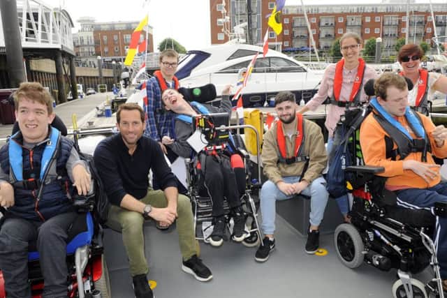 Sir Ben Ainslie named the new Wetwheels Solent boat joined by some of those who will be able to enjoy trips on her 

Picture:  Malcolm Wells (180608-3024)