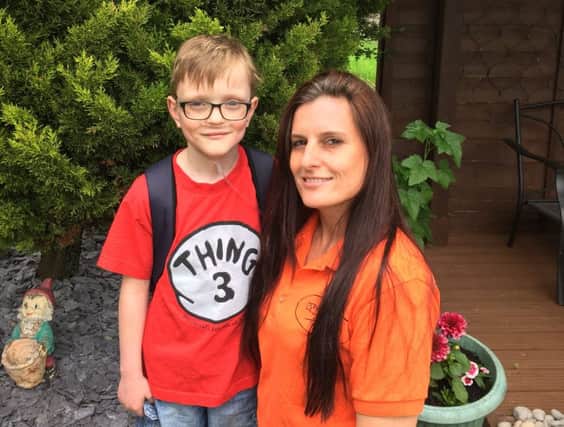 Liz Procter and her nephew, Sam.

Liz is doing a 'wing walk' for Sam's Haven
