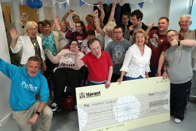 Former Mayor of Havant, Cllr Elaine Shimbart, (in the white blouse) presents a cheque to one of her charities from her mayoral time in office, FitzRoy, in London Road, Waterlooville. Picture: Chris Moorhouse