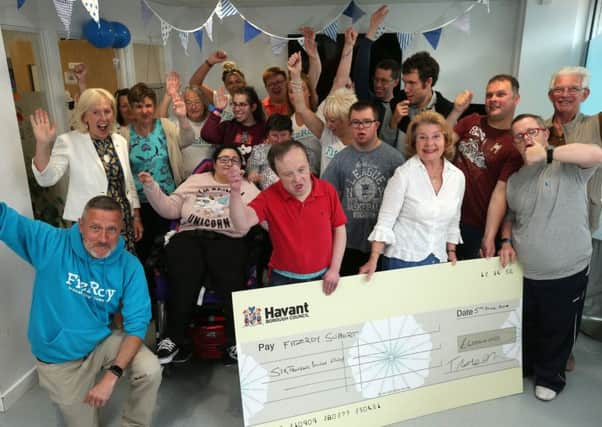 Former Mayor of Havant, Cllr Elaine Shimbart, (in the white blouse) presents a cheque to one of her charities from her mayoral time in office, FitzRoy, in London Road, Waterlooville. Picture: Chris Moorhouse