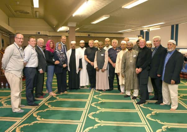 Members of the Muslim community, representatives if Hampshire fire and rescue, Cllr Gerald Vernon-Jackson and the editor of The News, Mark Waldron   

Picture: Habibur Rahman