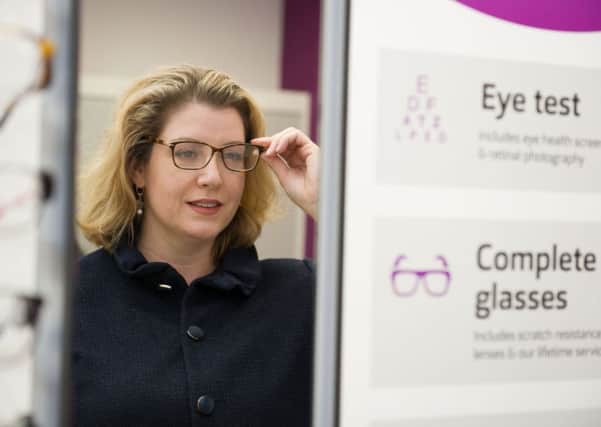 Portsmouth North MP Penny Mordaunt trying on a pair of glasses at the new Vision Express opticians in the Tesco Super Store in North Harbour Portsmouth   Credit: Steve Reid