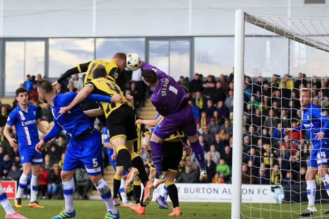 Tom Naylor heads Burton Albion into the Championship with the winning goal against Gillingham in 2016