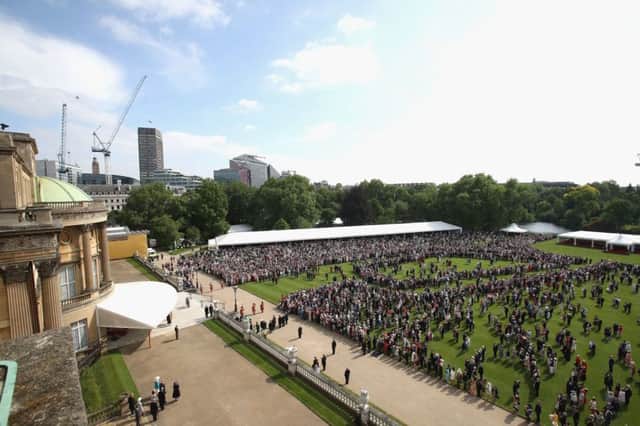 Guests attend a Royal Garden Party at Buckingham Palace, London. Picture by Chris Jackson/PA Wire