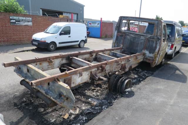 A burned-out van outside Toronto Place Tyres in Toronto Place in Gosport after Jacob's Well Care Centre was burgled on June 8