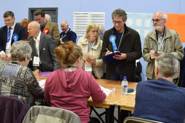 Candidates observe the count in Gosport last month. A trial was held forcing voters to bring proof of their identity to the polling station.
Picture: Duncan Shepherd