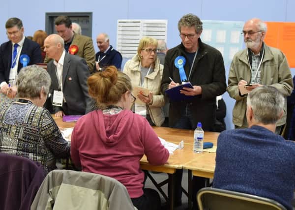 Candidates observe the count in Gosport last month. A trial was held forcing voters to bring proof of their identity to the polling station.
Picture: Duncan Shepherd
