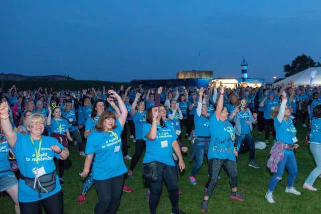 Rowans Hospice Moonlit Memories Walk - The walkers doing the Zumba warm upPicture: Vernon Nash (180392-0091) PPP-181006-122310006