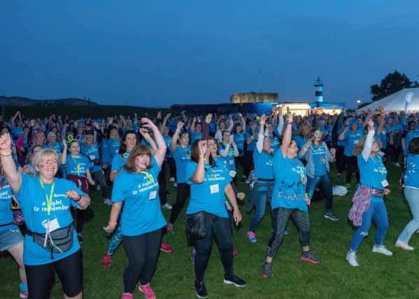 Rowans Hospice Moonlit Memories Walk - The walkers doing the Zumba warm up
Picture: Vernon Nash (180392-0091) PPP-181006-122310006