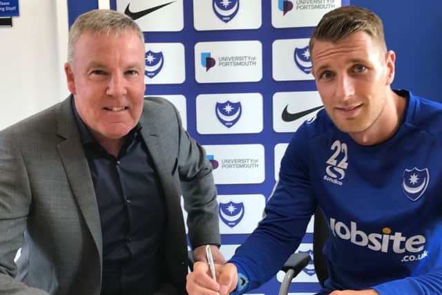 Pompey manager Kenny Jackett, left, welcomes Lee Brown to Fratton Park Picture: Portsmouth FC