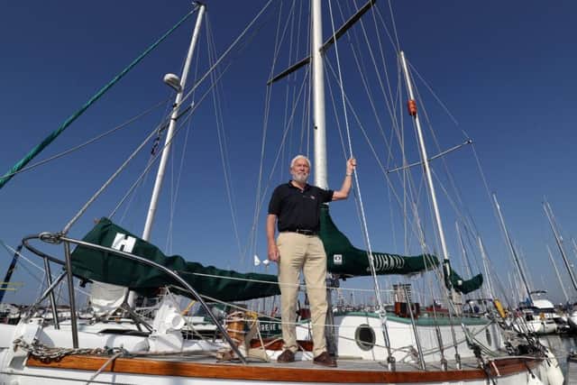 Sir Robin Knox-Johnston stands on the deck of his boat Suhaili. Picture: Andrew Matthews/PA Wire