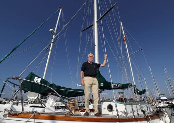 Sir Robin Knox-Johnston stands on the deck of his boat Suhaili. Picture: Andrew Matthews/PA Wire