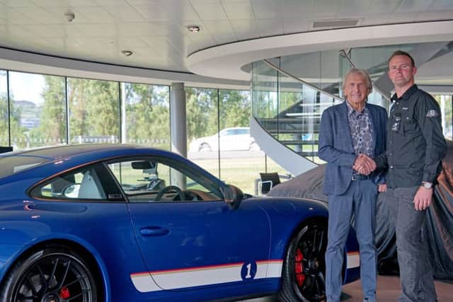 Tony Gatt, Centre Principal at Porsche Centre Portsmouth, with Derek Bell and the limited edition British Racing Legends 911 Carrera 4 GTS